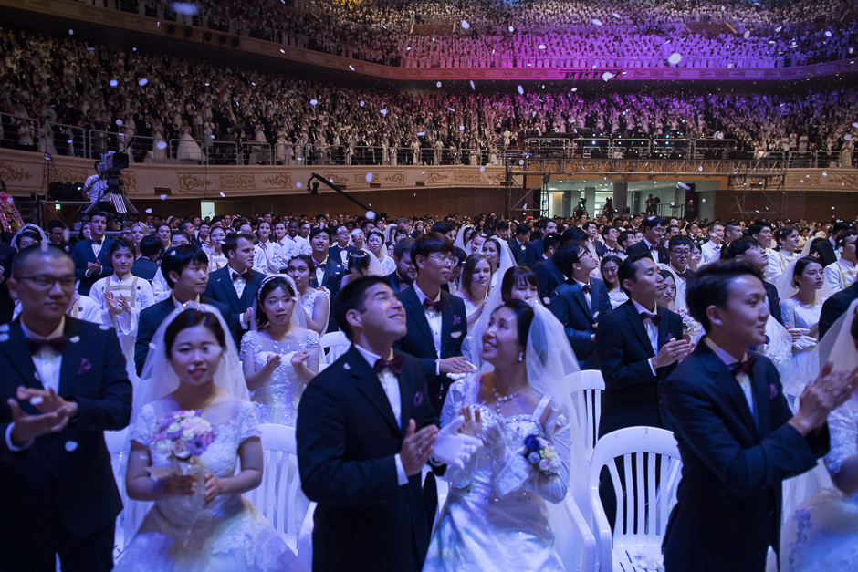 Couples attends a mass wedding ceremony held by the unification church entitled a 'cosmic blessing ceremony', in Gapyeong. PHOTO: AFP