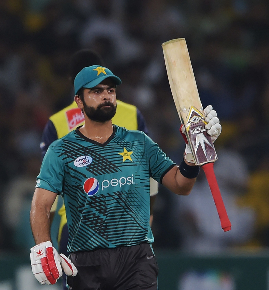 Ahmed Shahzad celebrates after scoring 50 runs during the third and final match. PHOTO: AFP