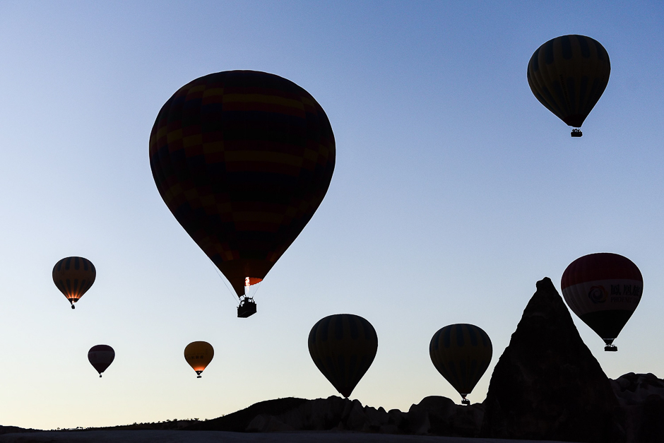 Hot air balloons glide in the sky during a flight over Nevsehir in Turkey's historical Cappadocia region, Central Anatolia, eastern Turkey. PHOTO: AFP