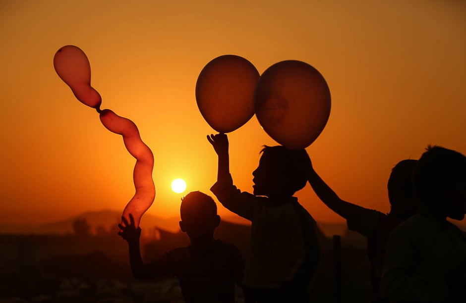 Syrian children play with balloons in the rebel-held town of Douma, on the eastern outskirts of Damascus. PHOTO: AFP