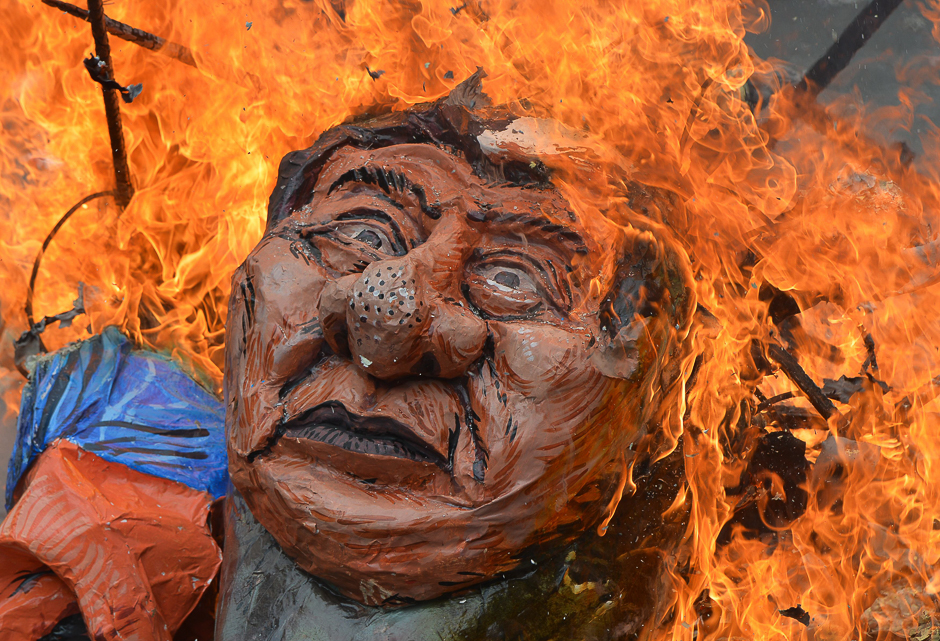 Anti-US protesters burn an effigy of Philippine President Rodrigo Duterte during a rally near the US embassy in Manila. PHOTO: AFP