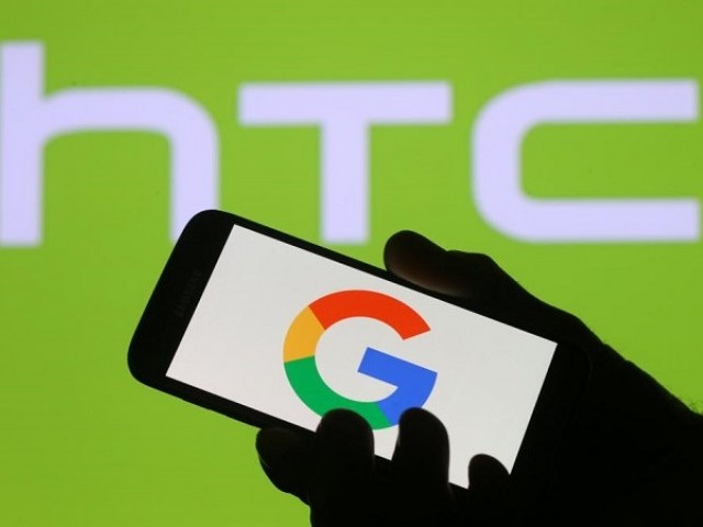 The Google logo is seen on a smartphone in front of a displayed HTC logo in this illustration taken September 21, 2017. PHOTO: REUTERS