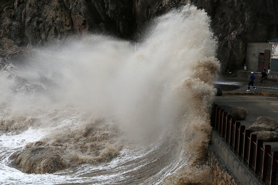 A wave, caused by Typhoon Talim, crashing over a promenade in Wenling in China's eastern Zhejiang province. PHOTO: AFP