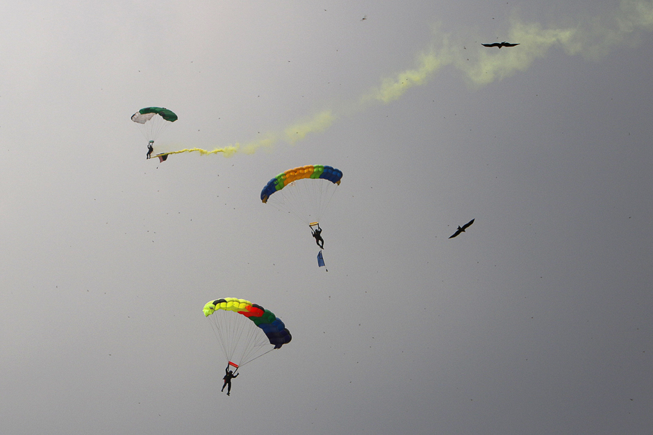Pakistan's army soldiers land by parachute as they take part during Defence Day ceremonies, or Pakistan's Memorial Day, in Lahore. PHOTO: REUTERS