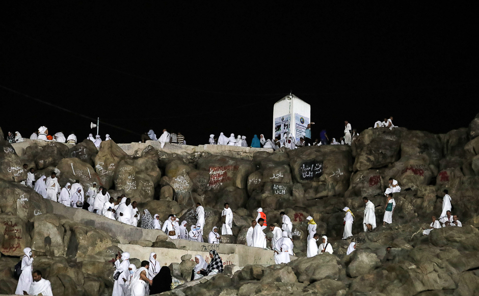Pilgrims walk and pray on Mount Arafat, also known as Jabal al-Rahma (Mount of Mercy), southeast of the Makkah, on the eve of Arafat Day which is the climax of the Hajj. PHOTO: AFP