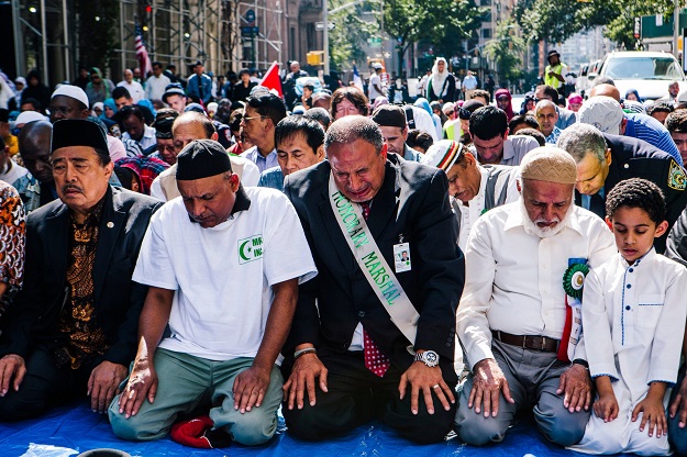 Another honorary marshal, Alaaeldin Moawad, cried during afternoon prayers before the start of the parade in Manhattan. PHOTO: NYT