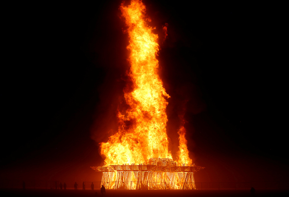 Participants walk to The Temple burn as approximately 70,000 people from all over the world gathered for the annual Burning Man arts and music festival in the Black Rock Desert of Nevada, US. PHOTO: REUTERS