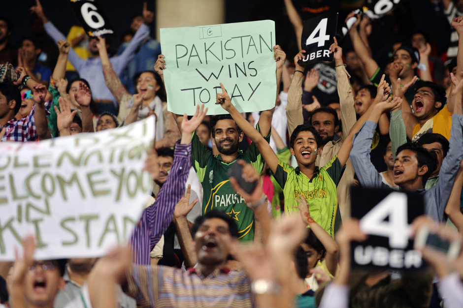 Pakistani spectators cheer as they watch the first Twenty20 international match. PHOTO: AFP