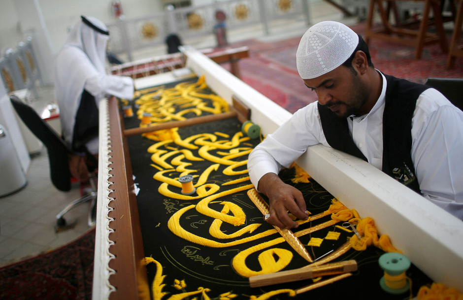 Men embroider the Kiswa, a silk cloth covering the Holy Kaaba, ahead of the Hajj, at a factory in Makkah. PHOTO: REUTERS