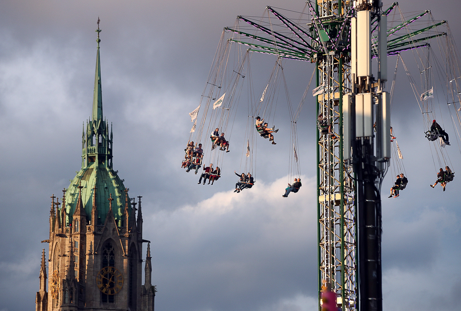 Visitors ride a swing ride during the opening day of the 184th Oktoberfest in Munich, Germany. PHOTO: REUTERS