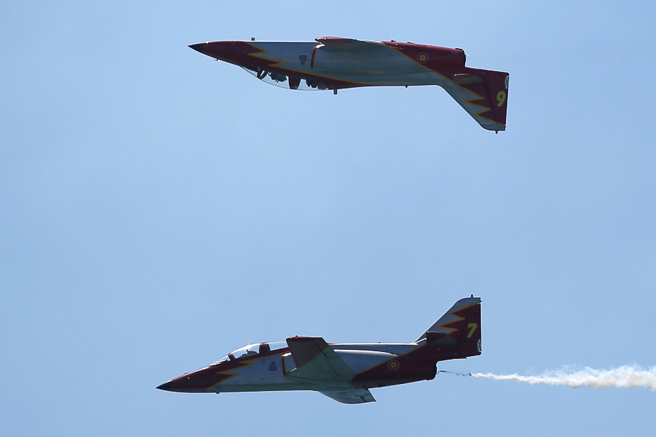 Casa C-101 Aviojets from the Spanish Air Force fly during an international aerial and naval military exhibition commemorating the centennial of the Spanish Naval Aviation in Rota, Spain. PHOTO: REUTERS