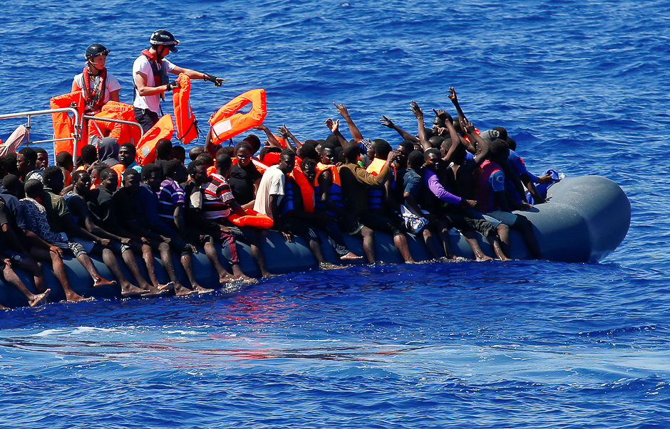 Migrants on a rubber boat are rescued by SOS Mediterranee organisation during a search and rescue (SAR) operation with the MV Aquarius rescue ship (not pictured) in the Mediterranean Sea, off the Libyan Coast. PHOTO: REUTERS
