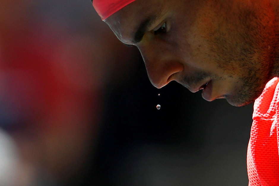 Sweat falls from Rafael Nadal of Spain during his fourth round match against Alexandr Dolgopolov of Ukraine, US Open, New York. PHOTO: REUTERS