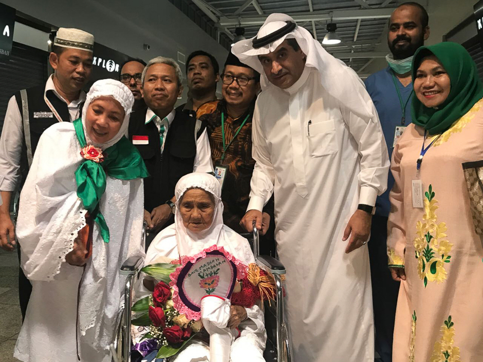 A 104-year-old Indonesian woman Mariah Marghani Muhammad (C), who is reportedly one of the oldest pilgrims attending the Hajj this year, arriving at the King Abdulaziz International Airport in Jeddah. PHOTO: AFP