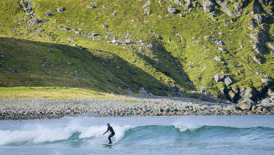 A surfer catches a wave in the water of Unstad beach on Lofoten Islands, Arctic Circle. PHOTO: AFP