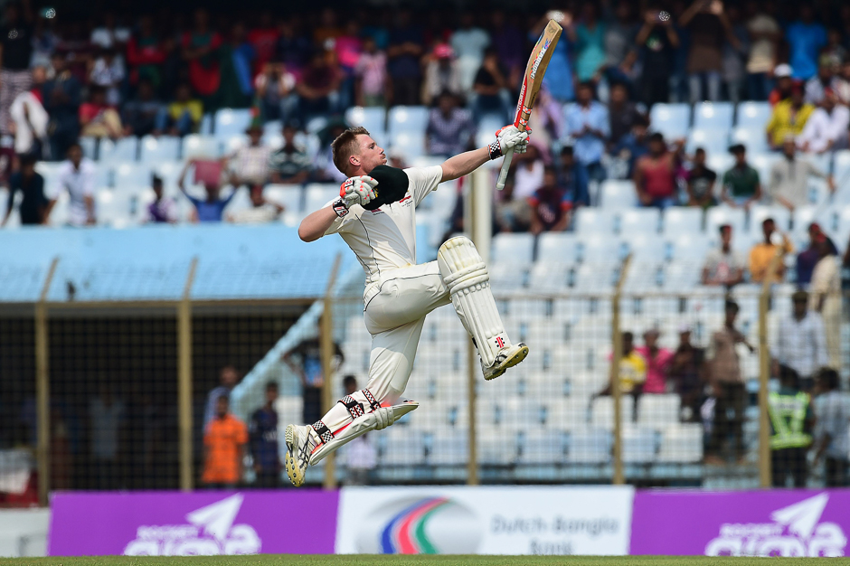 Australian cricketer David Warner reacts after scoring a century (100 runs) during the third day of the second cricket Test between Bangladesh and Australia at Zahur Ahmed Chowdhury Stadium in Chittagong. PHOTO: AFP