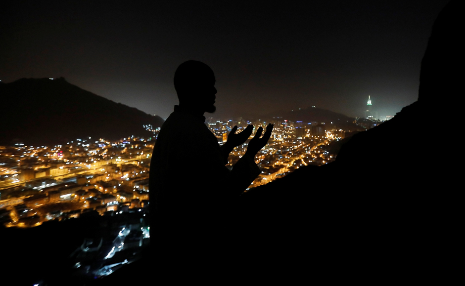 A muslim pilgrim prays at Mount Al-Noor where Muslims believe Prophet Mohammad (PBUH) received the first words of the Quran through Gabriel in the cave in the cave of Hira in Makkah. PHOTO: REUTERS
