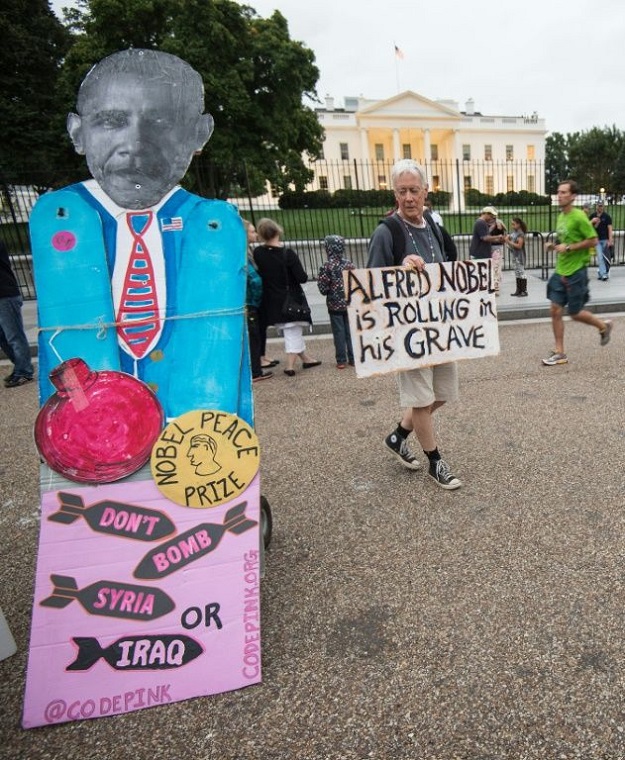 Anti-war activists are still demanding Barack Obama give back his Nobel prize over his failure to end wars in Iraq and Afghanistan. PHOTO: AFP 