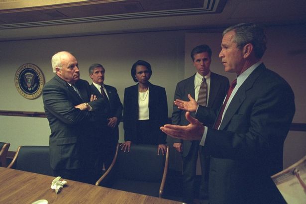 President George W. Bush talks with Vice President Dick Cheney, National Security Advisor Condoleezza Rice and other advisors. PHOTO: National Archives