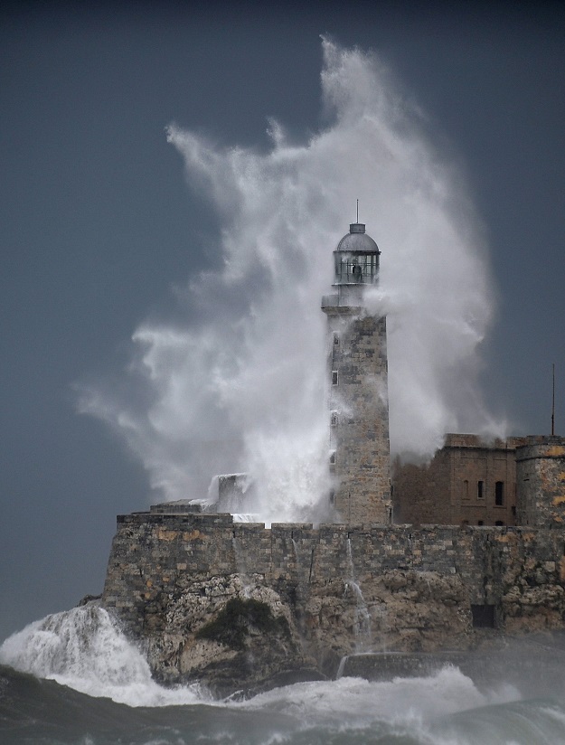 A huge wave breaks against Morro Castle in Havana. PHOTO: AFP