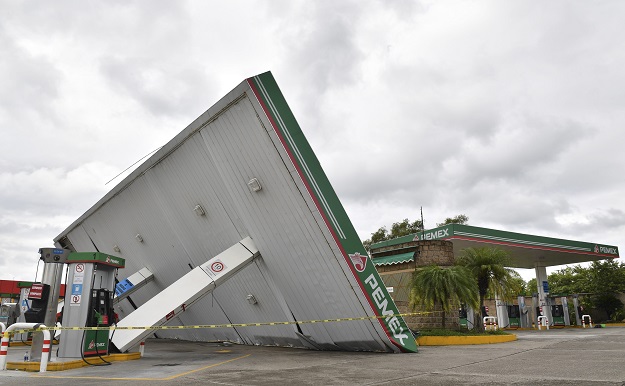 Picture of a gas station damaged by strong winds during the passage of Hurricane Katia in Poza Rica, Veracruz State, Mexico. PHOTO: AFP