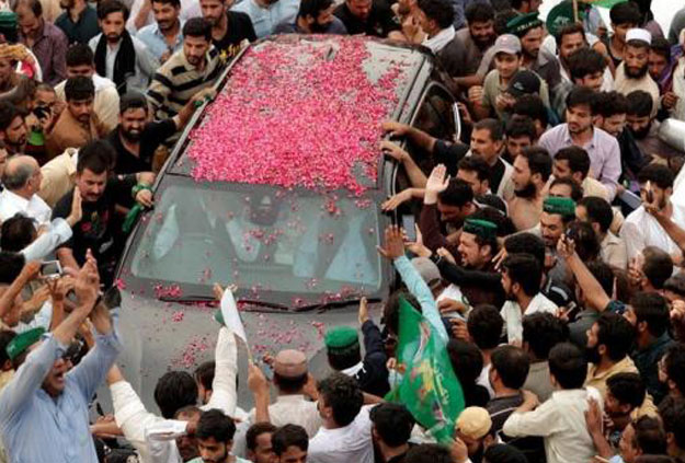 Crowd around Nawaz Sharifâs car after his convoy enters Rawalpindi during a rally on August 9. PHOTO: AFP 
