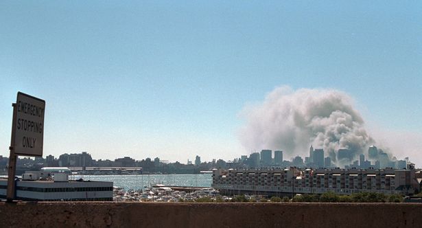 Smoke rises from the site of the World Trade Center, Sept. 11, 2001. PHOTO: George W. Bush Presidential Library