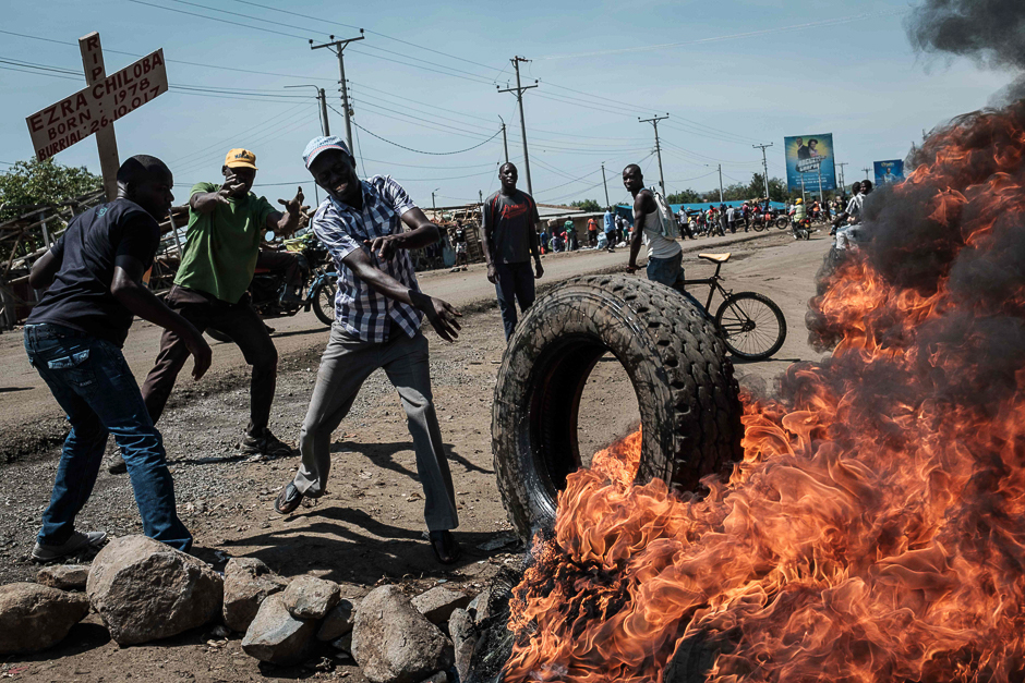 Supporters of National Super Alliance (NASA) presidential candidate Raila Odinga, burn tyres and barricade roads during a demonstration on the boycott of the upcoming re-election, in Kisumu, Kenya. PHOTO: AFP