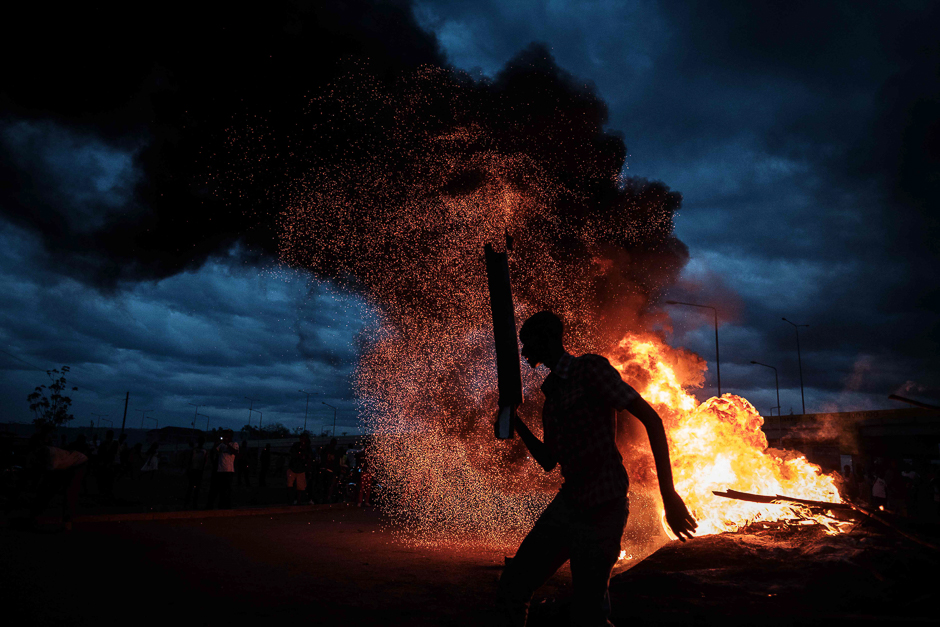 Supporters of National Super Alliance (NASA) presidential candidate Raila Odinga react after the result of re-elections as the incumbent President declared his victory in Kisumu. PHOTO: AFP