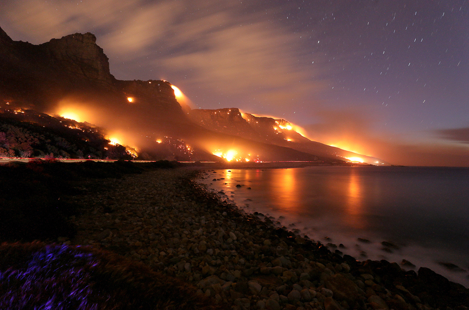 Wildfires burn along the Twelve Apostles area of Table Mountain in Cape Town, South Africa. PHOTO: REUTERS