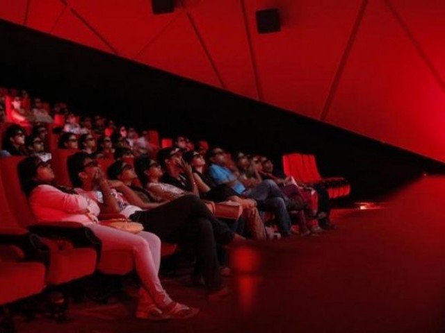 Cinema-goers wearing 3D glasses watch a movie at a Multiplex. PHOTO: REUTERS