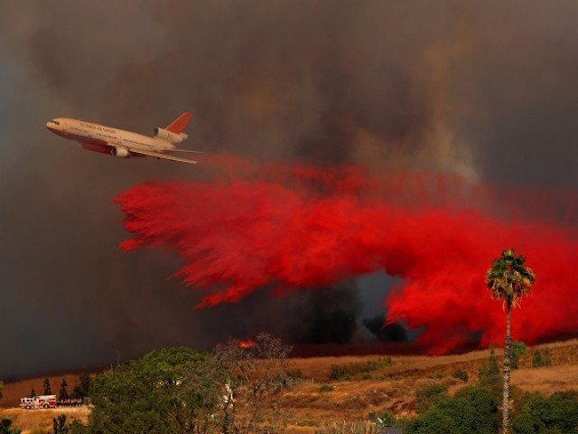 Image result for Thousands evacuate as California wildfires kill 10