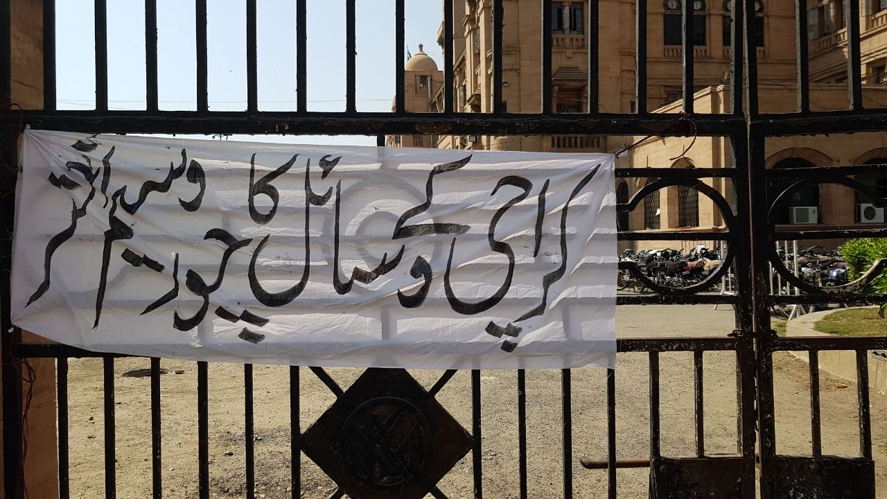 city council session banners criticising karachi s mayor put up at kmc building gate