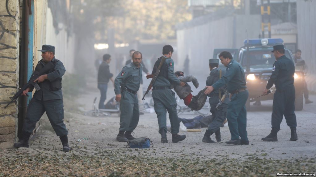 afghan police carry away a victim after a blast in a diplomatic zone of kabul on october 31 photo reuters