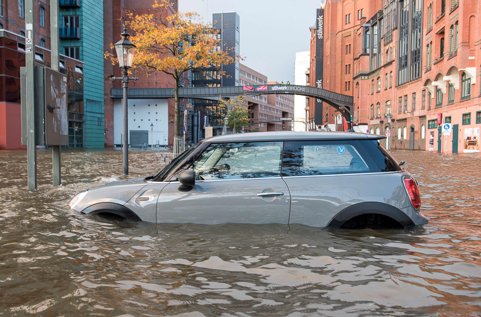 Flood waters surround a car parked at Hamburg's Fish Market district as a storm hit many parts of Germany. PHOTO: AFP