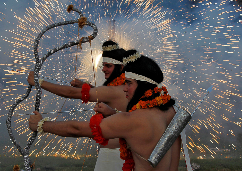 Artists dressed as Hindu gods Rama and Laxman act as fireworks explode during Vijaya Dashmi, or Dussehra festival celebrations in Chandigarh, India. PHOTO: REUTERS