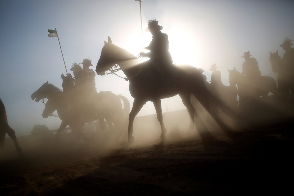 Descendants of soldiers from the Australian and New Zealand Army Corps (ANZAC) take part in a dress rehearsal of a re-enactment of the famous World War One cavalry charge known as 