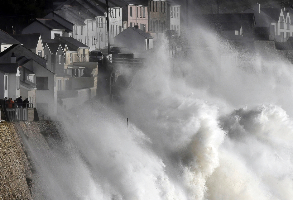 Large waves crash along sea defences and the harbour as storm Ophelia approaches Porthleven in Cornwall, south west Britain. PHOTO: REUTERS