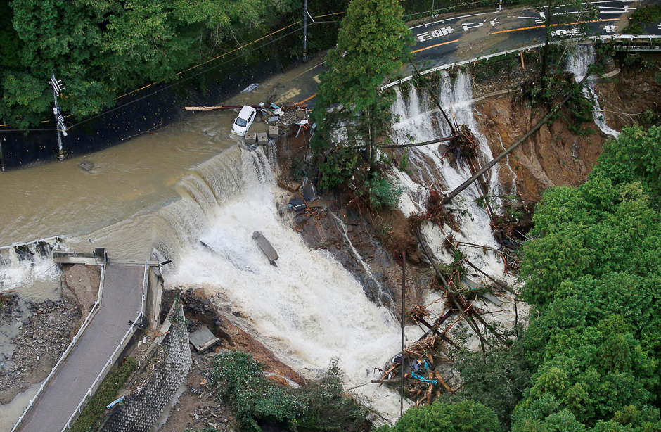 A collapsed road is seen following torrential rain caused by typhoon Lan in Kishiwada, Japan in this photo taken by Kyodo. PHOTO: REUTERS