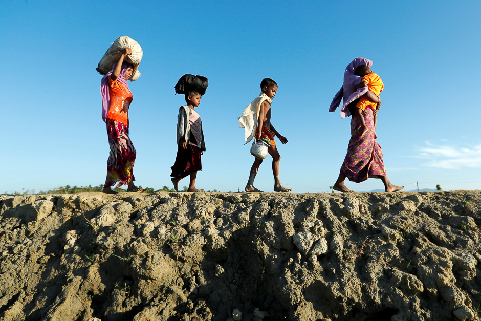 Rohingya refugees arrive at a beach after crossing from Myanmar, in Teknaf, Bangladesh. PHOTO: REUTERS