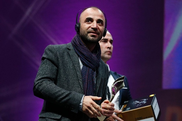 Iraqi photographer Ali Arkady receives the Photo Prize award at the Bayeux-Calvados Awards for war correspondents. PHOTO: AFP