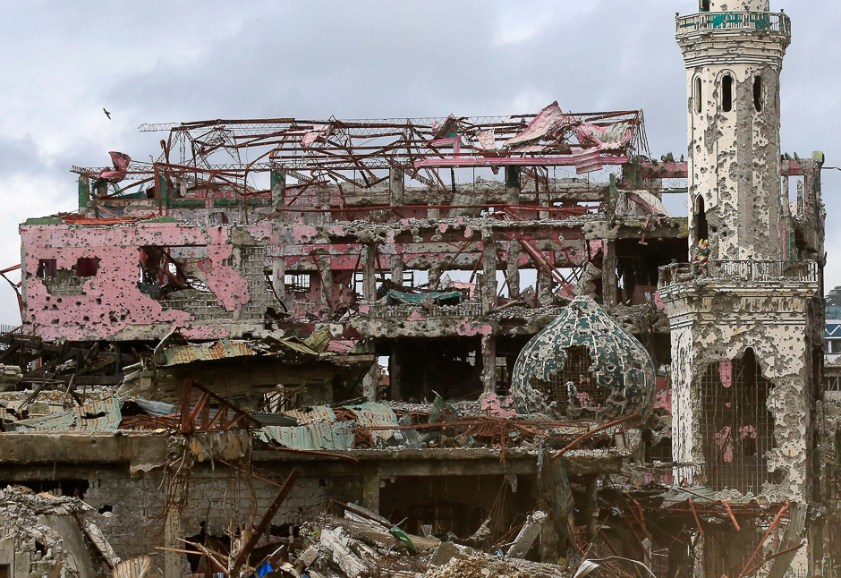 Damaged houses, buildings and a mosque are seen inside Marawi city, Philippines. PHOTO: REUTERS