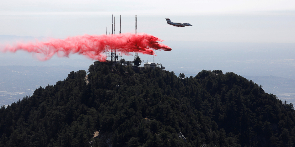 An airplane drops fire retardant while battling the Wilson Fire near Mount Wilson in the Angeles National Forest in Los Angeles, California, US. PHOTO: REUTERS