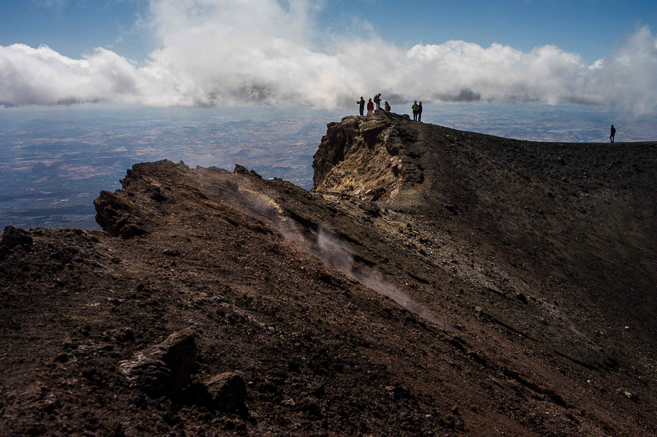 People hike on the Mount Etna volcano on the Italian island of Sicily. PHOTO: AFP