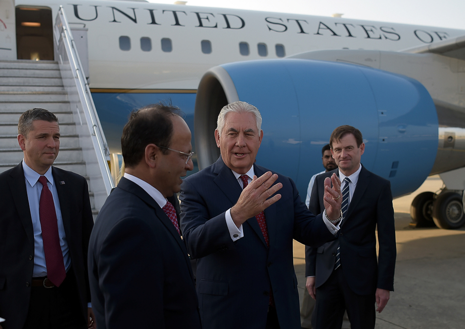 US Secretary of State Rex Tillerson chats with Pakistani foreign office official Sajid Bilal upon his arrival at Pakistan's Nur Khan military airbase in Islamabad, Pakistan. PHOTO: REUTERS