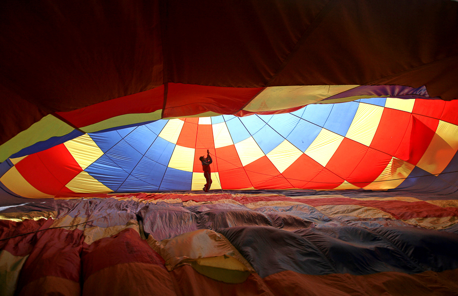 A man prepares a hot air balloon during the 2nd Hot Air Balloon Carnival in Nanjing, Jiangsu province, China. PHOTO: REUTERS