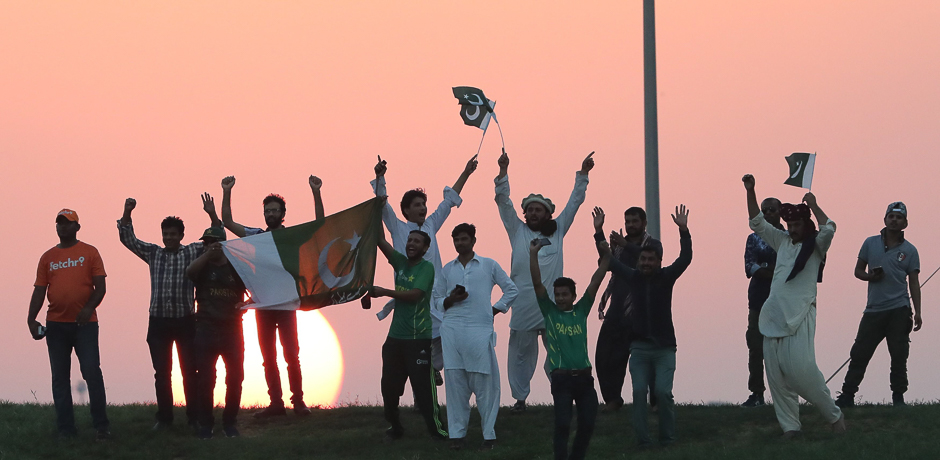 Pakistan fans celebrates during the third one day international (ODI) match between Pakistan and Sri Lanka in Abu Dhabi at Zayed Cricket Stadium. PHOTO: AFP