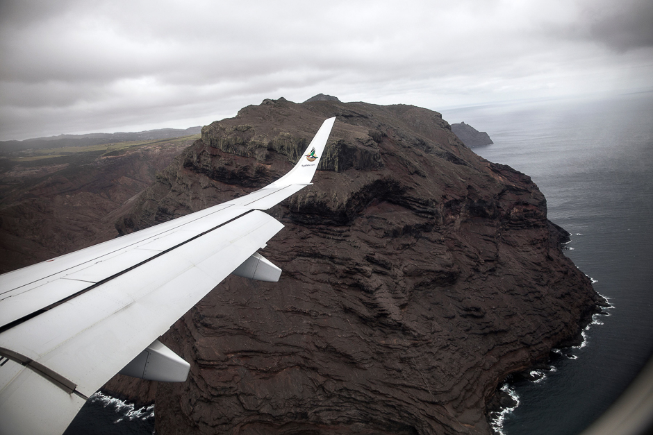 A picture taken from the inaugural first commercial flight between Johannesburg and Saint Helena shows the cliffs of the volcanic tropical island of Saint Helena, in the South Atlantic Ocean and part of the British Overseas Territory. PHOTO: AFP