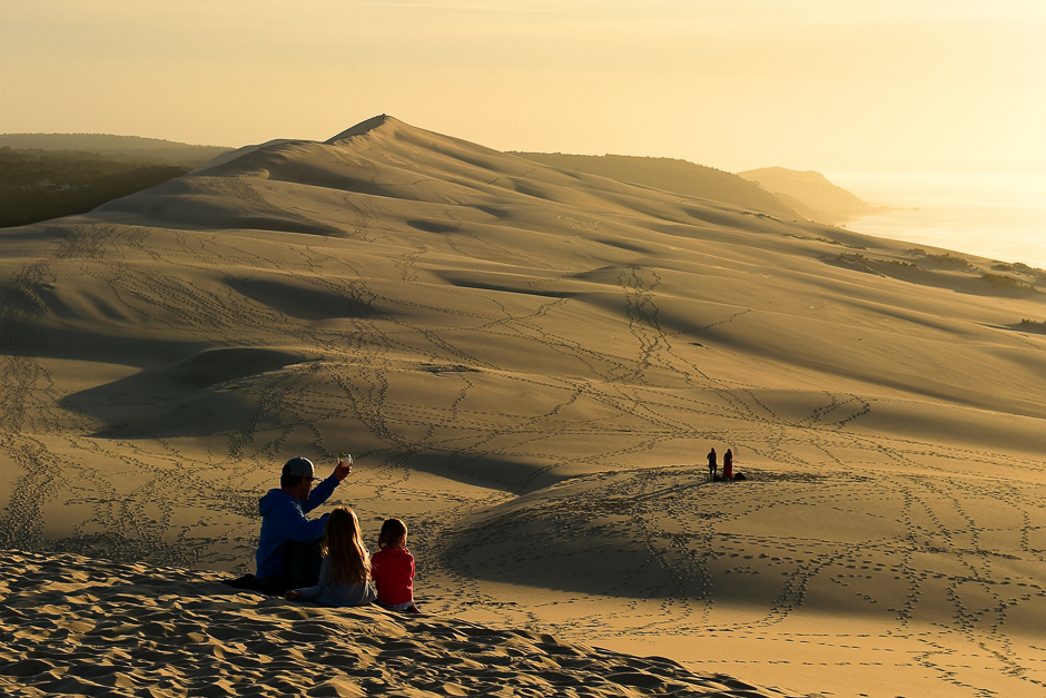 People watch the sunset on top of the dune of Pilat (or Pyla), the highest sand dune in Europe. PHOTO: AFP