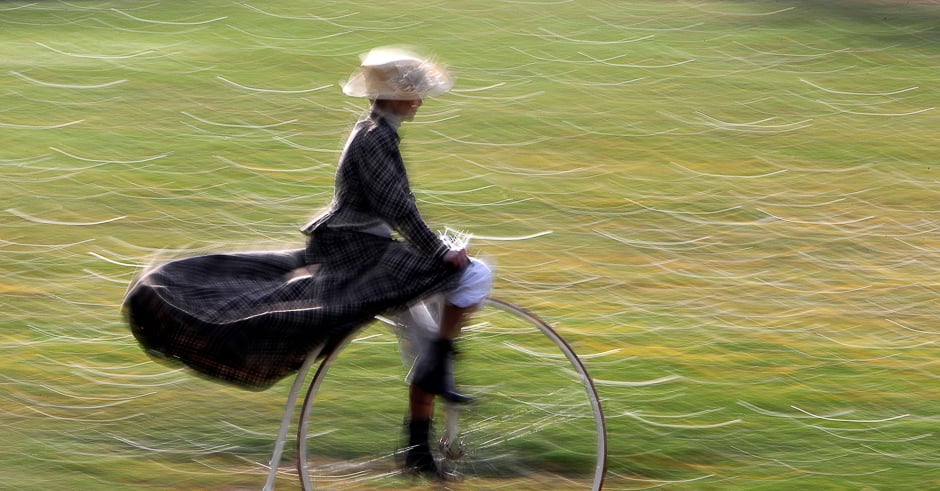 A participant wearing historical costume rides her high-wheel bicycle before the annual penny-farthing race in Prague, Czech Republic. PHOTO: REUTERS